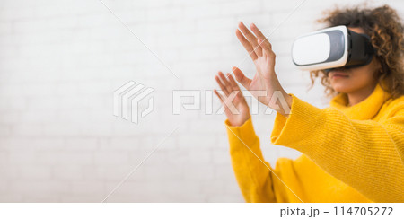 Future is now. Woman using VR headset and gesticulating, spending time at home, free space Future is now. Woman using VR headset and gesticulating, spending time at home, free space 114705272