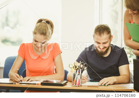 Students and teacher tutor in classroom 114706160