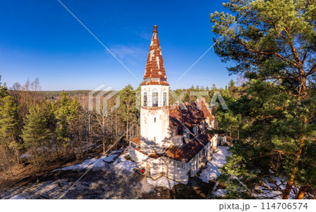Aerial top view to Finnish Lutheran Church in Lumivaara village. Building in Neo-Gothic style in summer sunny day. Attractions of Lahdenpokh district. Designed architect Adolf Ilmari. Karelia Russia 114706574