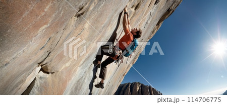 Climber Scaling a Steep Cliff 114706775