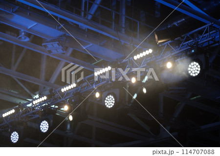 Stage lighting equipment indoor stage. Entertainment concert lighting. Led lighting devices under roof. download 114707088