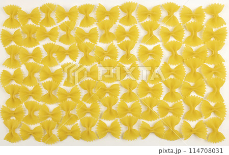 Isolated pasta in the form of bows with clipping path on a white background. Isolated pasta in the form of bows with clipping path on a white background. 114708031