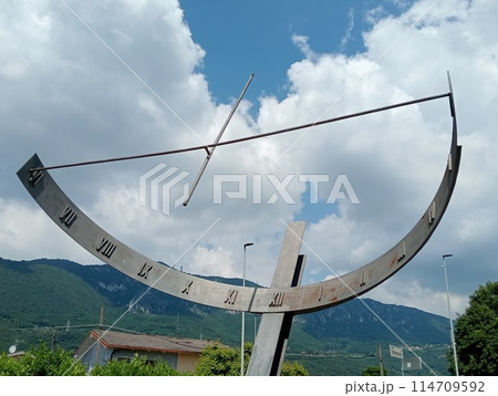 ancient vertical iron construction used as a sundial tower Botticino, Brescia in northern Italy ancient vertical iron construction used as a sundial tower Botticino, Brescia in northern Italy 114709592