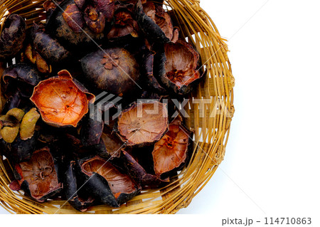 Dried mangosteen peels on white background. Dried mangosteen peels on white background. 114710863