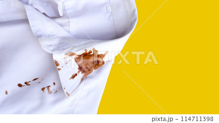 Dirty choclate stain on white shirt 114711398