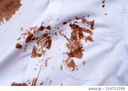 Dirty choclate stain on white shirt 114711399