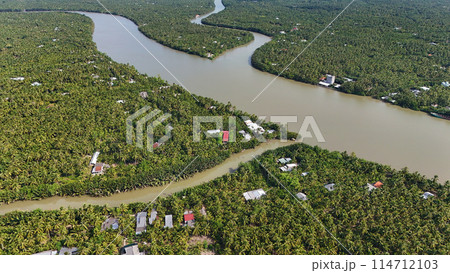 Amazing aerial view of Mekong Delta, vast coconut, palm, nipa tree field, irrigation system by canal with many river branch, water source for agriculture and waterway transport with cheap 114712103