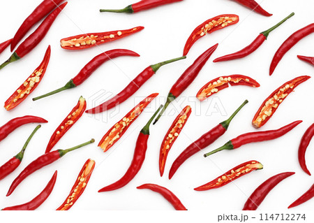Red chili peppers on white background Red chili peppers on white background 114712274