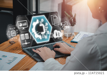 EDI, Electronic data interchange concept, Businesswoman using laptop computer on desk with electronic, data and interchange icon on virtual screen. EDI, Electronic data interchange concept, Businesswoman using laptop computer on desk with electronic, data and interchange icon on virtual screen. 114715021