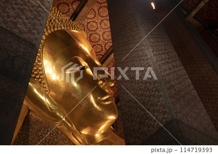 The giant reclining Buddha golden statue is seen at Wat Pho temple complex The giant reclining Buddha golden statue is seen at Wat Pho temple complex 114719393