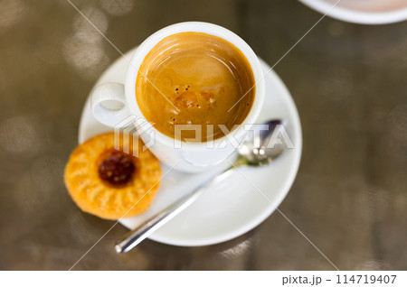 Cup of cortado, Spanish beverage made of espresso with dessert Cup of cortado, Spanish beverage made of espresso with dessert 114719407