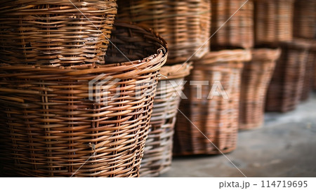 Exquisite handwoven wicker baskets, meticulously arranged. 114719695