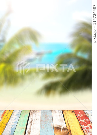 Blank wooden table top on blurred tropical seascape background. Wood terrace flooring and ocean beach. Tropical resort. Summer time concept. Relaxing on sea cost Blank wooden table top on blurred tropical seascape background. Wood terrace flooring and ocean beach. Tropical resort. Summer time concept. Relaxing on sea cost 114724407