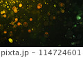 Bokeh lights green orange on black background. Abstract Lights. Unfocused Light background. Blurred night light. bokeh background, Blur concept colorful effect 114724601
