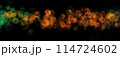 Bokeh lights green orange on black background. Abstract Lights. Unfocused Light background. Blurred night light. bokeh background, Blur concept colorful effect 114724602