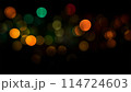 Bokeh lights green orange on black background. Abstract Lights. Unfocused Light background. Blurred night light. bokeh background, Blur concept colorful effect 114724603