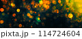 Bokeh lights green orange on black background. Abstract Lights. Unfocused Light background. Blurred night light. bokeh background, Blur concept colorful effect 114724604