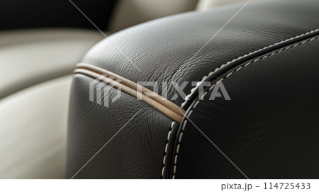 White thread stitching on black leather 114725433