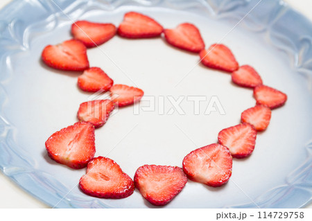 Beautiful heart symbol from chopped red juicy strawberry Beautiful heart symbol from chopped red juicy strawberry 114729758