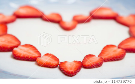 Beautiful heart symbol from chopped red juicy strawberry Beautiful heart symbol from chopped red juicy strawberry 114729770
