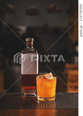 Whiskey cocktail on bar counter 114730360