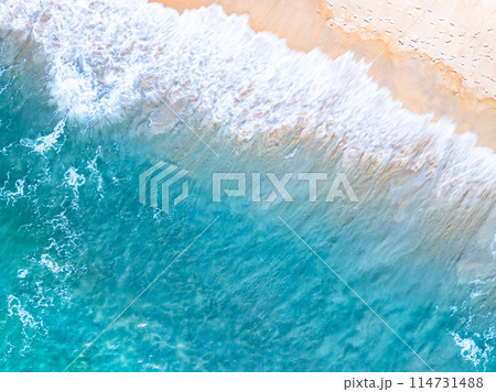 Amazing Top view sea beach landscape background,Summer sea waves crashing on sandy shore seascape background,High angle view ocean nature background Amazing Top view sea beach landscape background,Summer sea waves crashing on sandy shore seascape background,High angle view ocean nature background 114731488