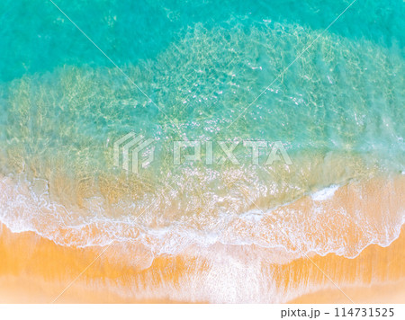 Amazing Top view sea beach landscape background,Summer sea waves crashing on sandy shore seascape background,High angle view ocean nature background 114731525
