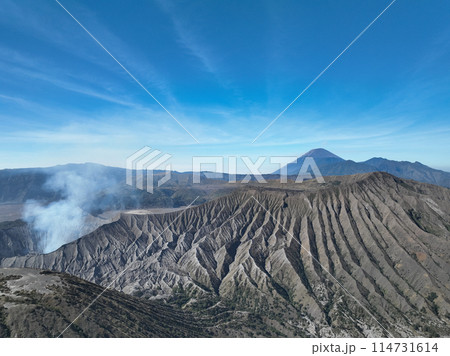 Aerial view Mountains at Bromo volcano during sunny sky,Beautiful Mountains Penanjakan in Bromo Tengger Semeru National Park,East Java,Indonesia.Nature landscape background 114731614