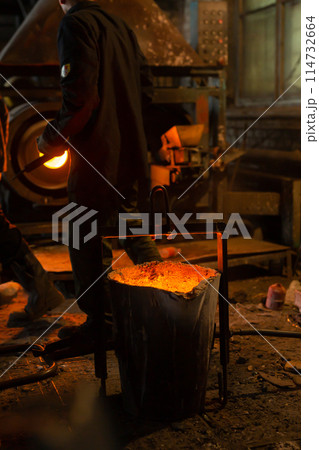 Foundry ladle with molten metal in workshop of metallurgical plant 114732664