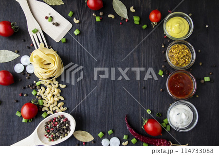 Cooking food background with free space for text. Composition with ingredients over the wood background. Ingredients for cooking with copy space. Top view with copy space Cooking food background with free space for text. Composition with ingredients over the wood background. Ingredients for cooking with copy space. Top view with copy space 114733088