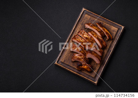 Delicious juicy grilled ribs with honey and mustard sauce Delicious juicy grilled ribs with honey and mustard sauce 114734156