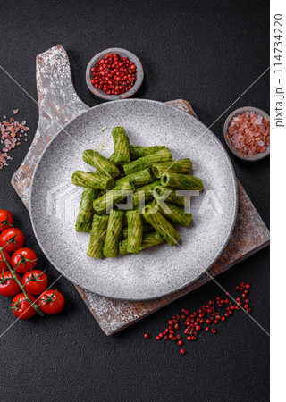 Delicious pasta with spinach sauce, olive oil and parmesan cheese 114734220