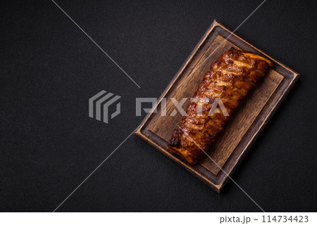 Delicious juicy grilled ribs with honey and mustard sauce 114734423