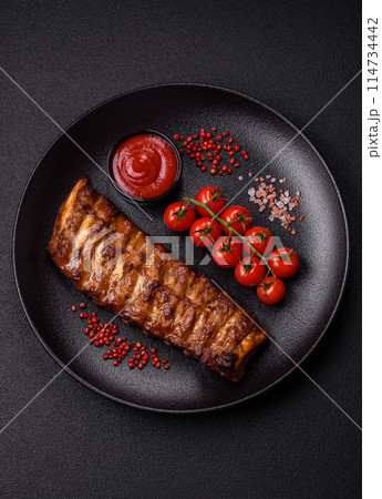 Delicious juicy grilled ribs with honey and mustard sauce Delicious juicy grilled ribs with honey and mustard sauce 114734442