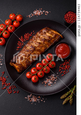Delicious juicy grilled ribs with honey and mustard sauce Delicious juicy grilled ribs with honey and mustard sauce 114734463