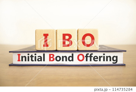 IBO initial bond offering symbol. Concept words IBO initial bond offering on beautiful wooden blocks and book. Beautiful white background. Business IBO initial bond offering concept. Copy space. 114735284
