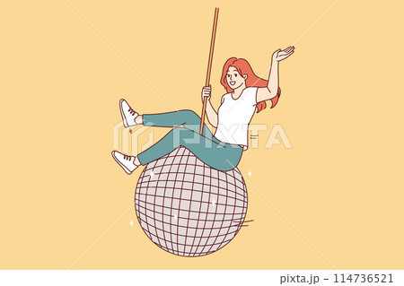 Woman swings on large disco ball and waves hand welcomingly, inviting guests to student party 114736521