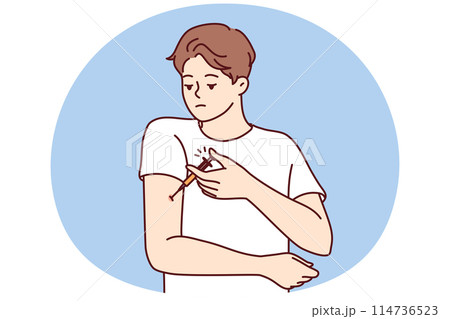 Man with diabetes makes injection in arm to lower blood sugar and avoid insulin shock 114736523