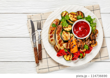 grilled white sausages with veggies and mushrooms 114736690