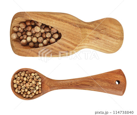 Dried coriander seeds in the wooden spoon and scoop isolated on white background. Top view. Flat lay 114738840