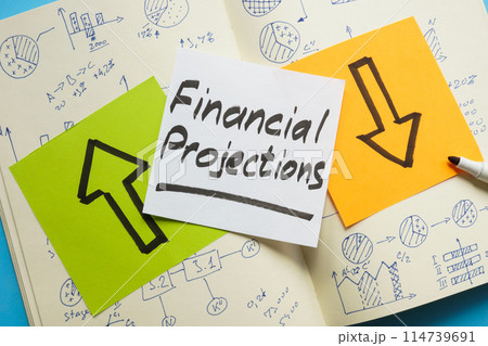 Financial projections concept. Open notepad with business notes and a sticky note with words. 114739691