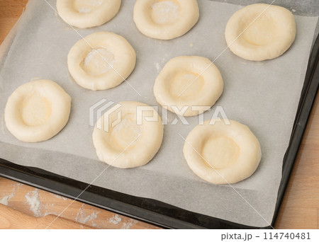 ring of dough with quark in the middle. baking at home, Ball dough with cottage cheese 114740481