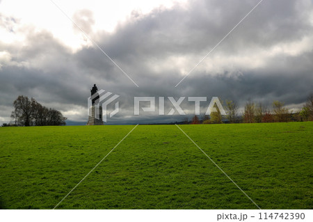 View of Bannockburn Battlefield in Scotland with Statue of Robert the Bruce on a Stormy Afternoon View of Bannockburn Battlefield in Scotland with Statue of Robert the Bruce on a Stormy Afternoon 114742390