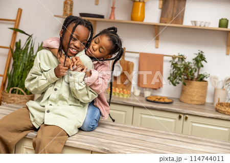Children having fun enjoying playtime at home in kitchen 114744011