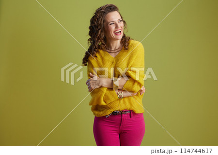 happy fit 40 years old woman on green background 114744617