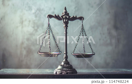 Brass scales of justice symbolizing balance and equality in the legal system, with gavel and law book on table Brass scales of justice symbolizing balance and equality in the legal system, with gavel and law book on table 114748224