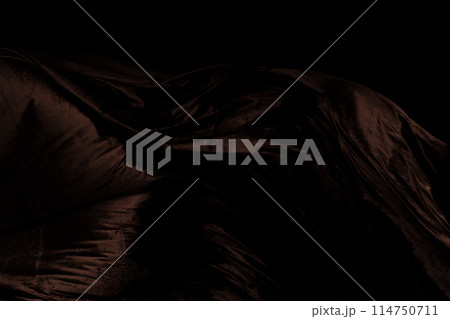 Brown velvet felt fabric flying in curve shape, Piece of textile Brown velvet felt fabric throw fall in air. Black background isolated, dark shading environment Brown velvet felt fabric flying in curve shape, Piece of textile Brown velvet felt fabric throw fall in air. Black background isolated, dark shading environment 114750711
