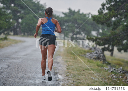 Unstoppable: A Determined Athlete Trains Through the Rain in Pursuit of Marathon Glory Unstoppable: A Determined Athlete Trains Through the Rain in Pursuit of Marathon Glory 114751258
