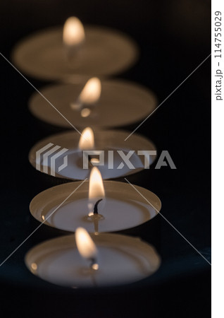 Burning candles in a church. Selective focus. Shallow depth of field. Burning candles in a church. Selective focus. Shallow depth of field. 114755029