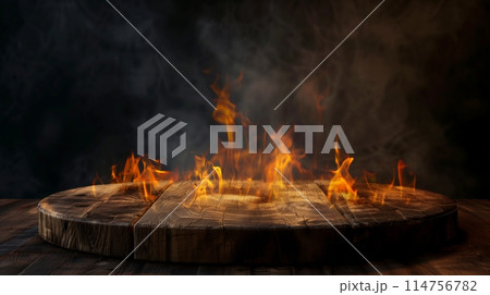A wooden podium against a dark backdrop, lit by flame glow. 114756782